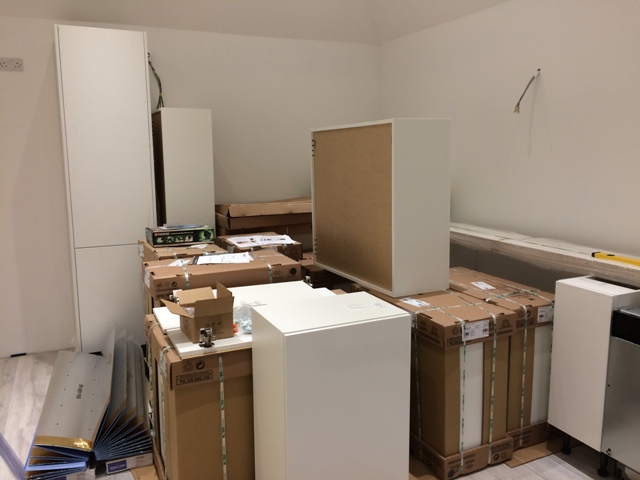 tall-kitchen-cabinet-and-base-kitchen-units-going-into-place